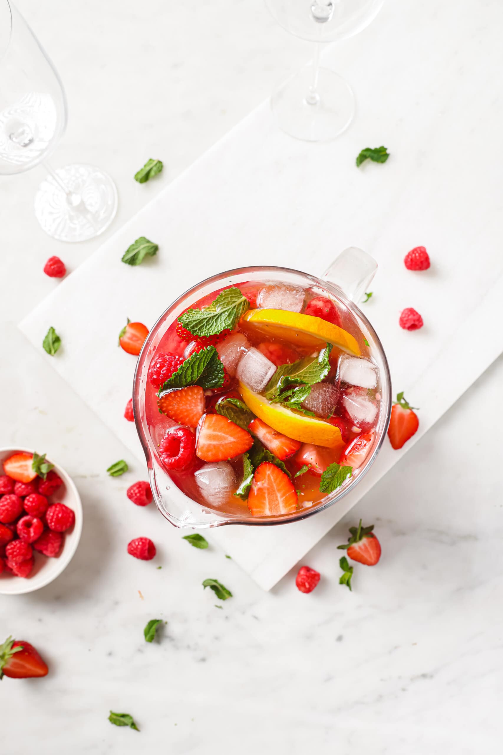 Overhead shot of strawberry rose sangria with ice. 