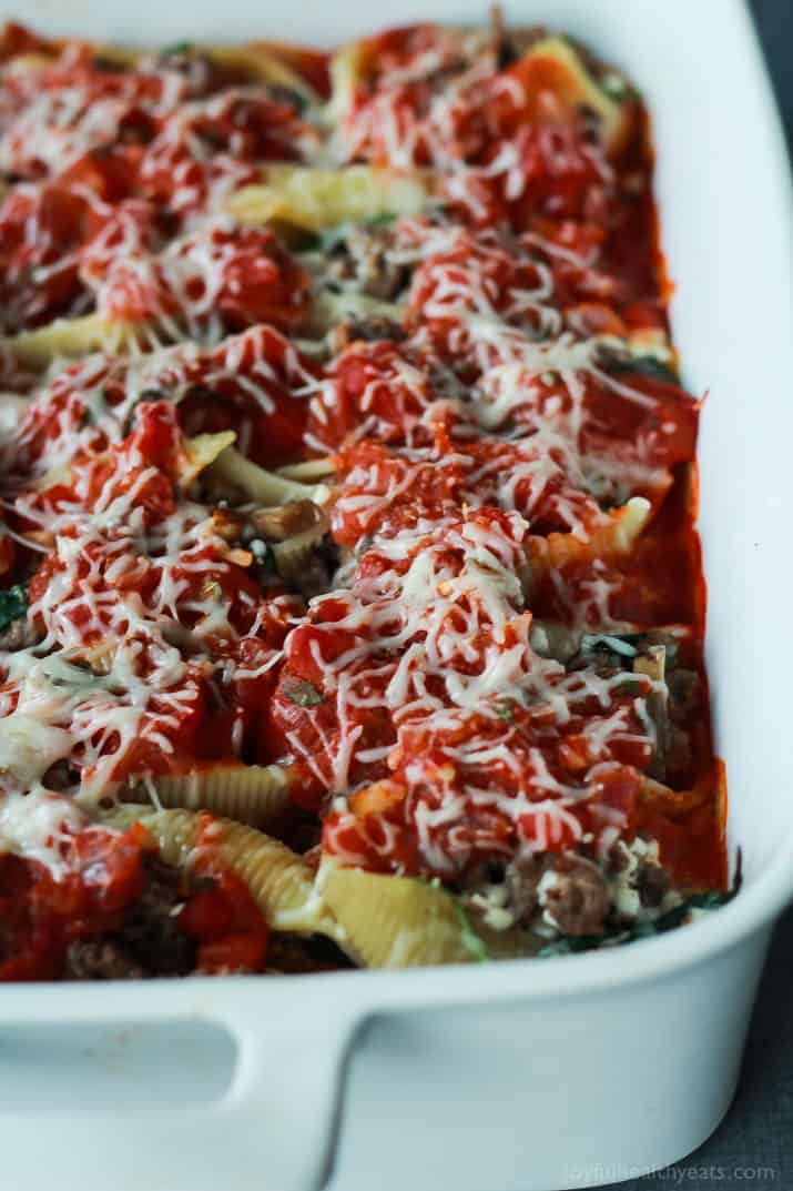 An easy Stuffed Shells recipe with ground beef, spinach, and mushrooms then topped with a homemade marinara sauce - all for only 223 calories per serving! | joyfulhealthyeats.com #recipes