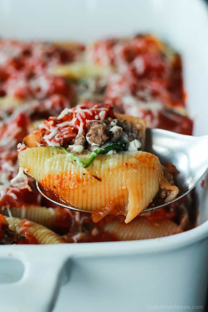 An easy Stuffed Shells recipe with ground beef, spinach, and mushrooms then topped with a homemade marinara sauce - all for only 223 calories per serving! | joyfulhealthyeats.com #recipes