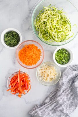 With juicy pan-seared Thai chicken, loads of fresh veggies, and a zesty peanut sauce, this 20-minute dinner is guaranteed to be a favorite! Ingredients for Thai chicken with zucchini noodles.