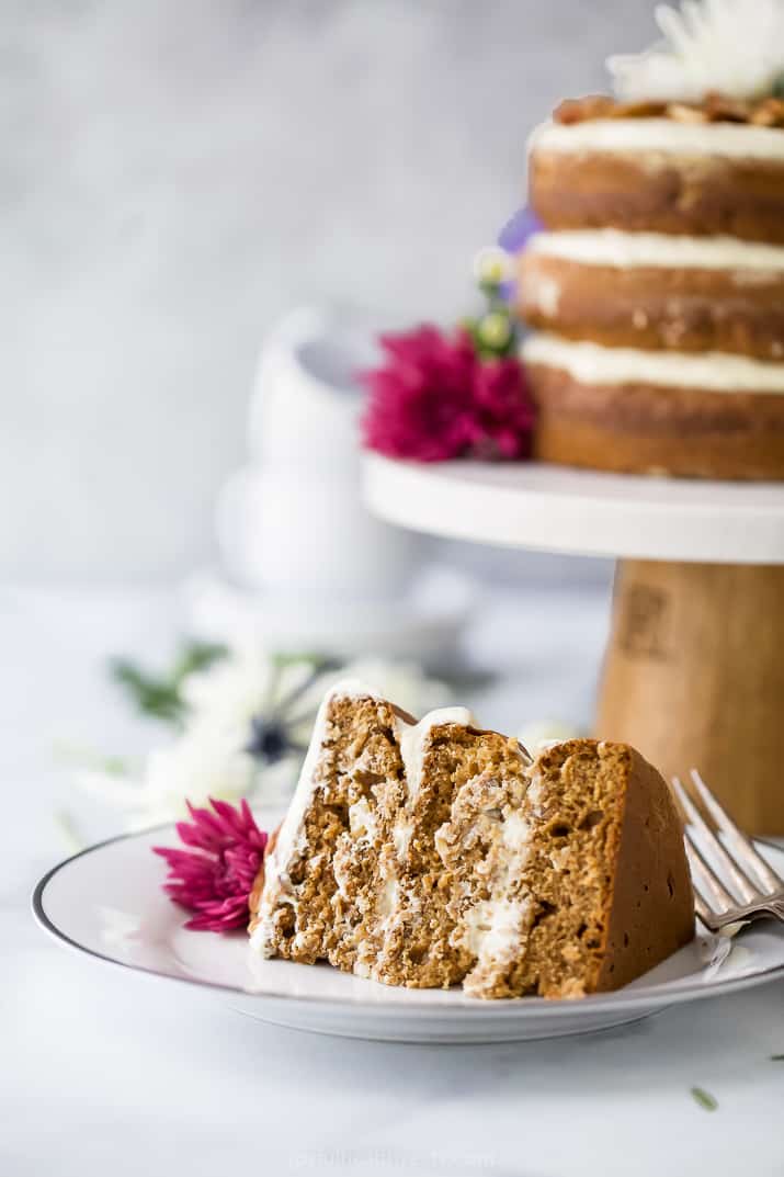 a slice of The BEST Hummingbird Cake Recipe with Light Cream Cheese Frosting on a plate