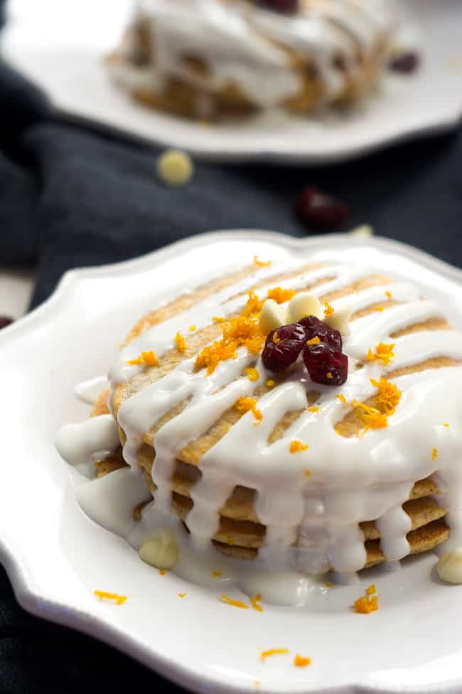 A Stack of Whole Wheat Cranberry Bliss Pancakes Covered in Icing