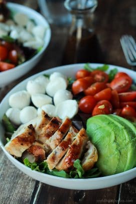 A Quick Easy Dinner for two, Avocado Caprese Chicken Salad topped with a light Balsamic Vinaigrette. The perfect Salad recipe for summer that only takes 15 minutes! | joyfulhealthyeats.com #recipe