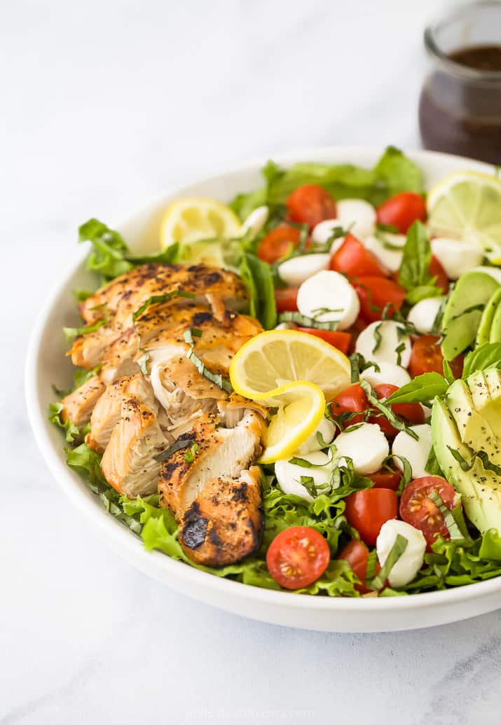 side photo of avocado caprese chicken salad in a bowl 