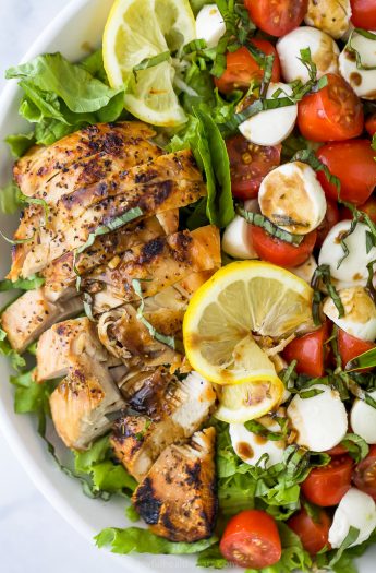 close up photo of avocado caprese chicken salad with balsamic dressing in a bowl