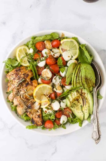 overhead photo of avocado caprese chicken salad with balsamic vinaigrette