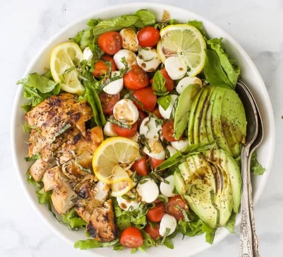 overhead photo of avocado caprese chicken salad with balsamic vinaigrette