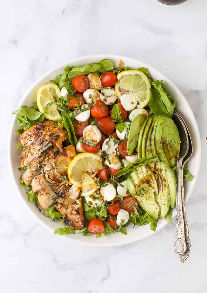 overhead photo of avocado caprese chicken salad with balsamic vinaigrette