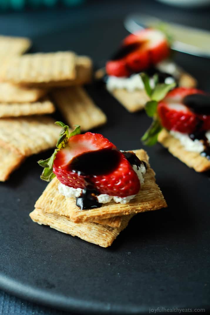 Strawberry Goat Cheese Bites on Triscuits topped with a Balsamic Reduction Drizzle