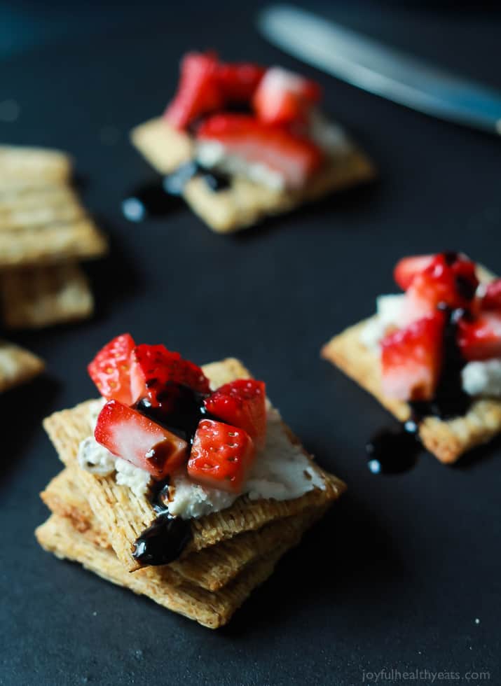 Strawberry Goat Cheese Bites on Triscuits topped with a Balsamic Reduction Drizzle