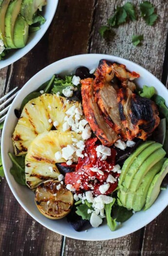 Harissa Lime Grilled Chicken Salad with a Creamy Cilantro Lime Vinaigrette, filled with grilled pineapple, limes, fresh avocado and an amazing dressing! Add to your list! | joyfulhealthyeats.com #glutenfree #recipes