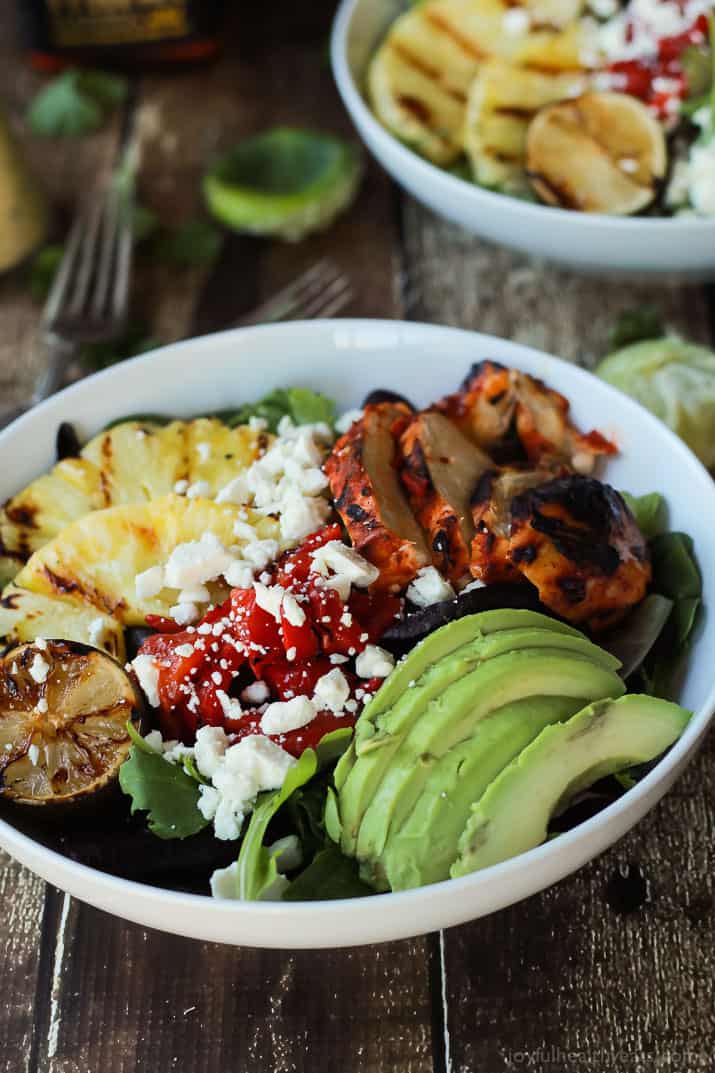Harissa Lime Grilled Chicken Salad with sliced avocado, pineapple, roasted red pepper and crumbled feta