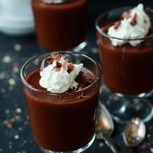 Three Cups of Mousse Beside Two Metal Spoons