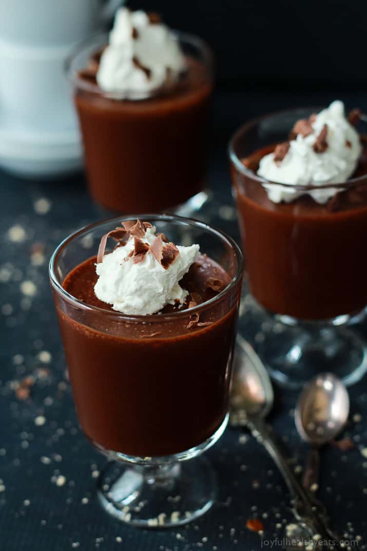 Three Cups of Mousse Beside Two Metal Spoons