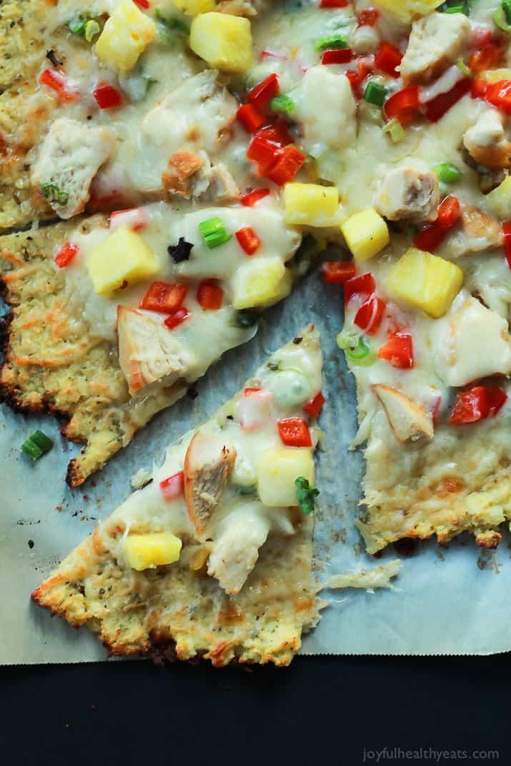 Thai Chili Chicken Pizza with a Cauliflower Crust, topped with a Sweet Spicy Thai Chili Sauce, fresh pineapple, bell peppers, and chicken. An easy gluten free pizza recipe that will be on your table in 25 minutes! | joyfulhealthyeats.com #recipes 