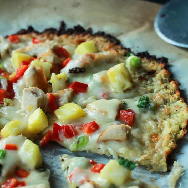 Thai Chili Chicken Pizza with a Cauliflower Crust, topped with a Sweet Spicy Thai Chili Sauce, fresh pineapple, bell peppers, and chicken. An easy gluten free pizza recipe that will be on your table in 25 minutes! | joyfulhealthyeats.com #recipes 