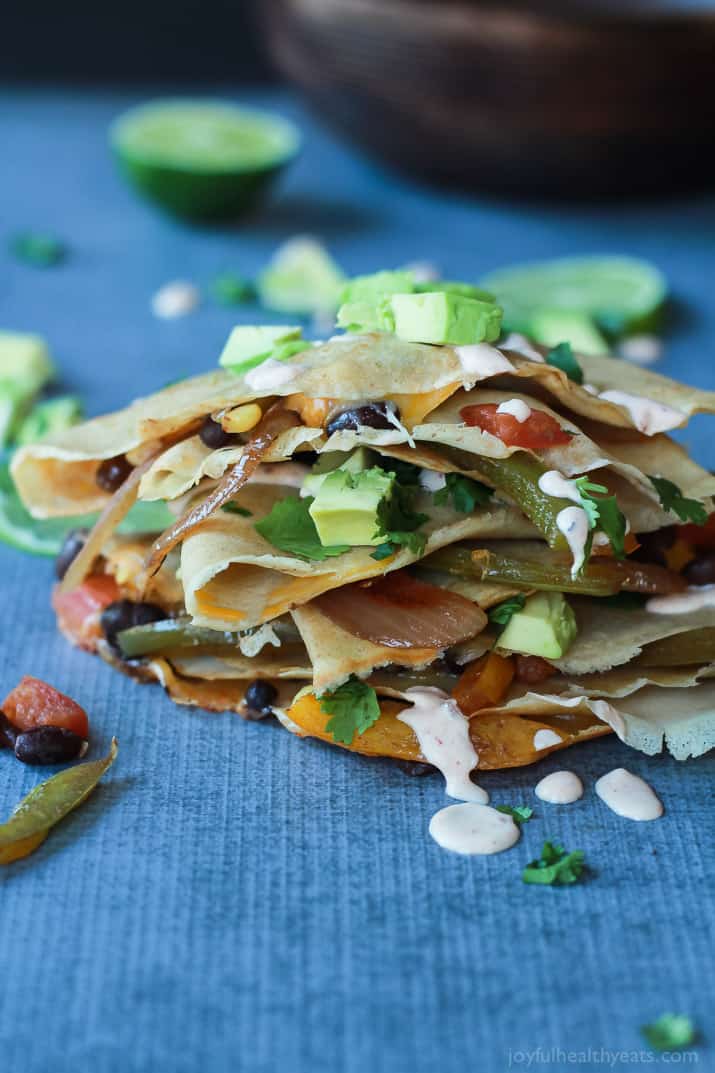 Easy Tex-Mex Vegetarian Crepe Quesadillas filled with fresh corn, bell peppers, black beans, and onions then topped with a drizzle of Chipotle Lime Crema! An appetizer that is to die for! | joyfulhealthyeats.com #recipes