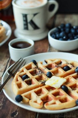 Whole Wheat Lemon Blueberry Waffles, these Waffles are packed with juicy blueberries and fresh lemon zest for the perfect light summer breakfast recipe! | joyfulhealthyeats.com #brunch #mothersday