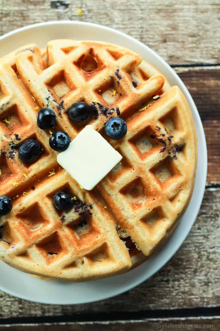 Whole Wheat Lemon Blueberry Waffles, these Waffles are packed with juicy blueberries and fresh lemon zest for the perfect light summer breakfast recipe! | joyfulhealthyeats.com #brunch #mothersday