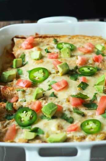 Easy Chicken Enchilada Recipe topped with a Creamy Green Chili Sauce that's made with Greek Yogurt, smoked paprika, and spicy green chilis! An easy weeknight meal that beats going out! | joyfulhealthyeats.com #recipes