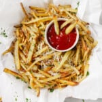 Garlic parmesan fries with a side of ketchup.