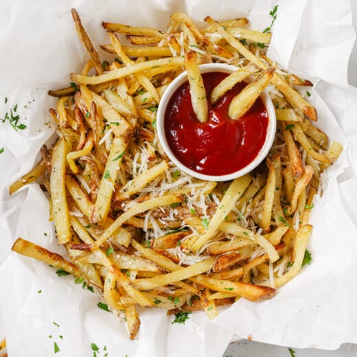 Garlic parmesan fries with a side of ketchup.