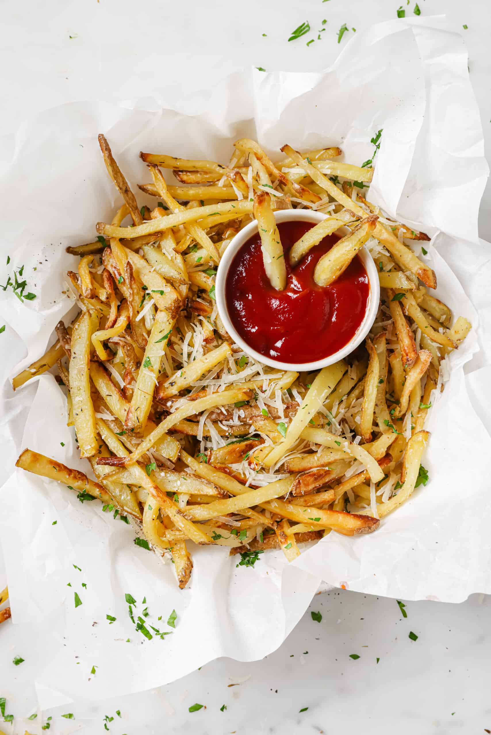 Garlic parmesan fries with a side of ketchup. 