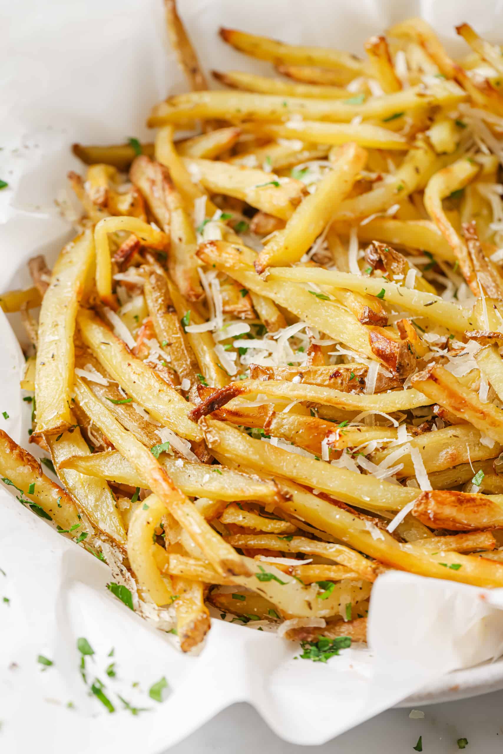 Close-up of crispy fries with parmesan. 