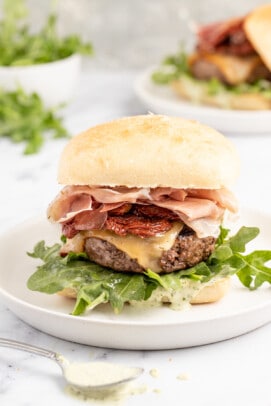 Italian cheeseburger on a plate.