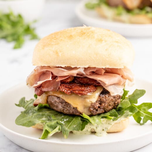 Italian cheeseburger on a plate.