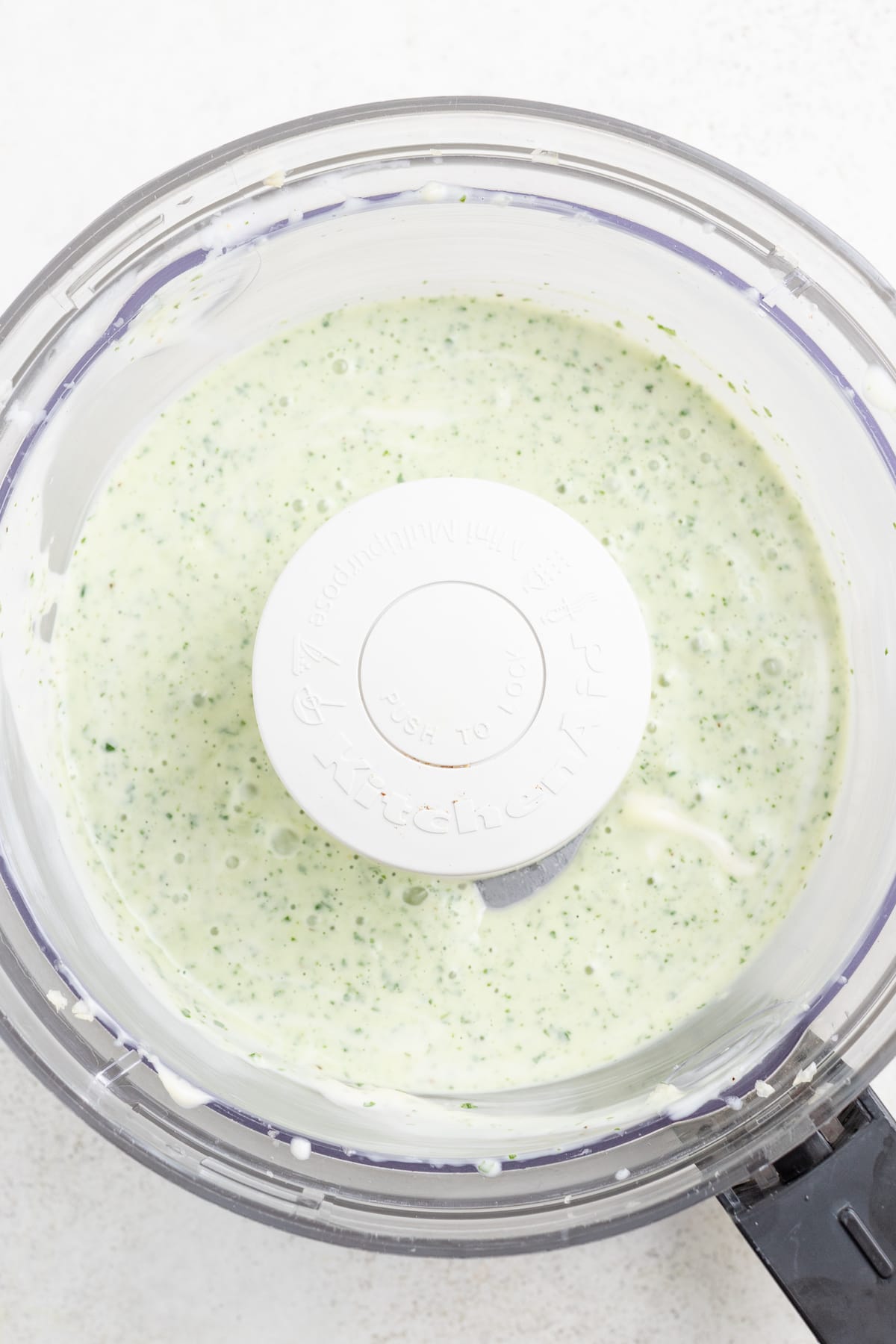 Basil pesto aioli in the food processor. 