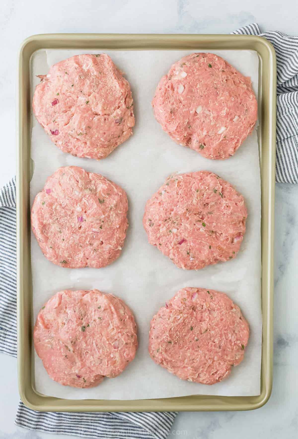 Formed patties in a baking tray.