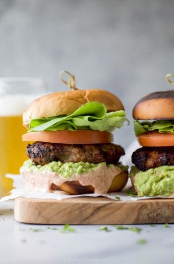 Two turkey hamburgers with homemade mayo and guac.