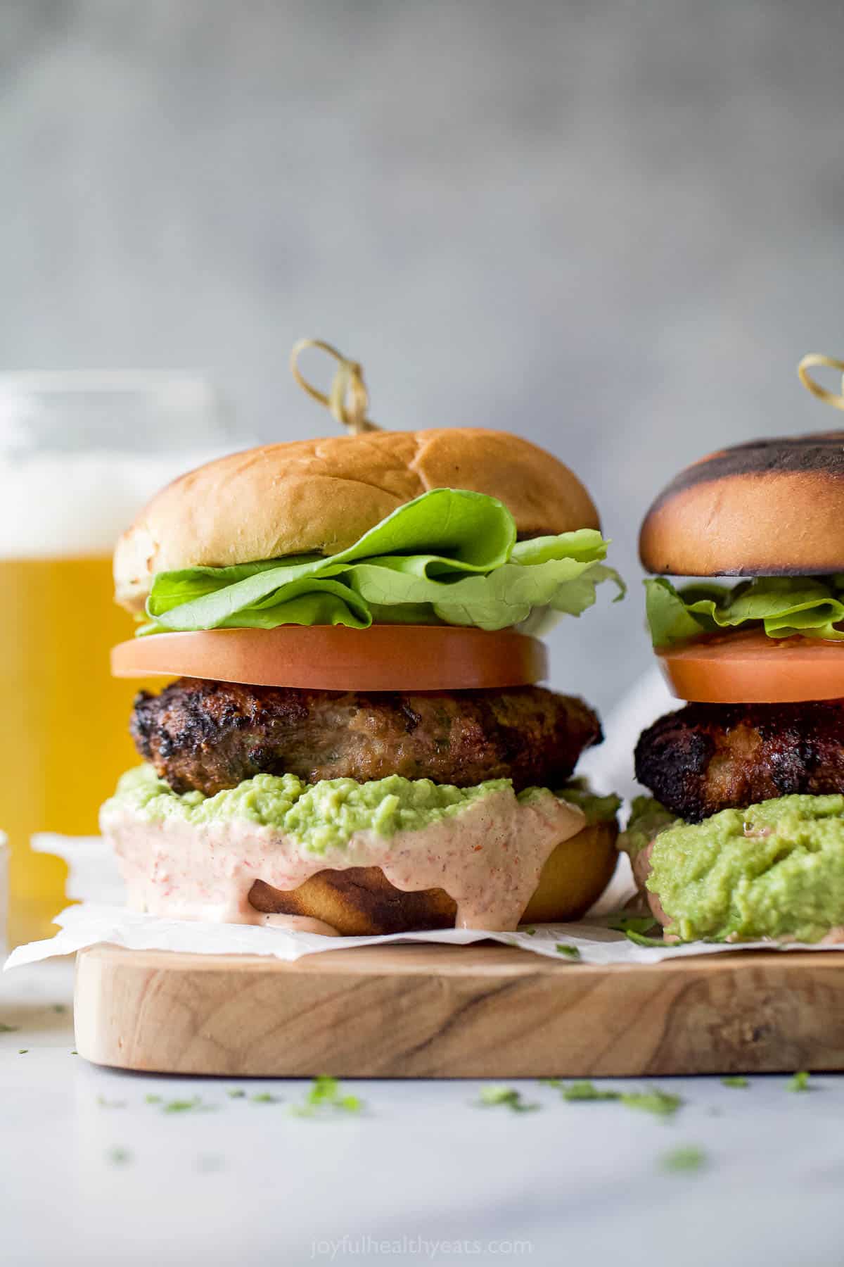 Two turkey hamburgers with homemade mayo and guac. 