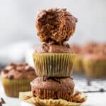 skinny double chocolate banana muffins stacked in a tower