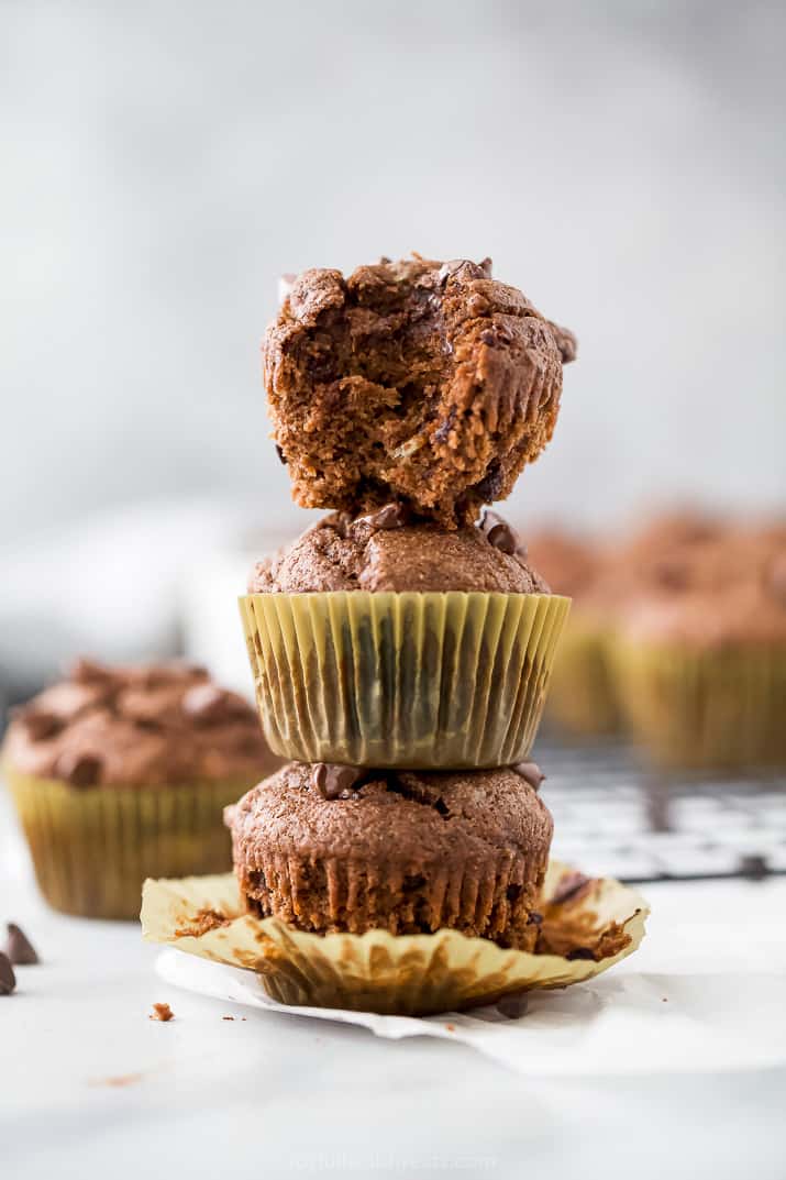 skinny double chocolate banana muffins stacked in a tower