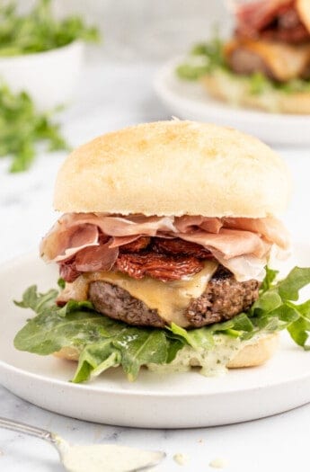 Italian cheeseburger on a plate.