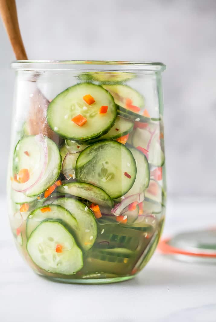 close up photo of 10 Minute Easy Asian Cucumber Salad Recipe (Dairy Free) in glass jar