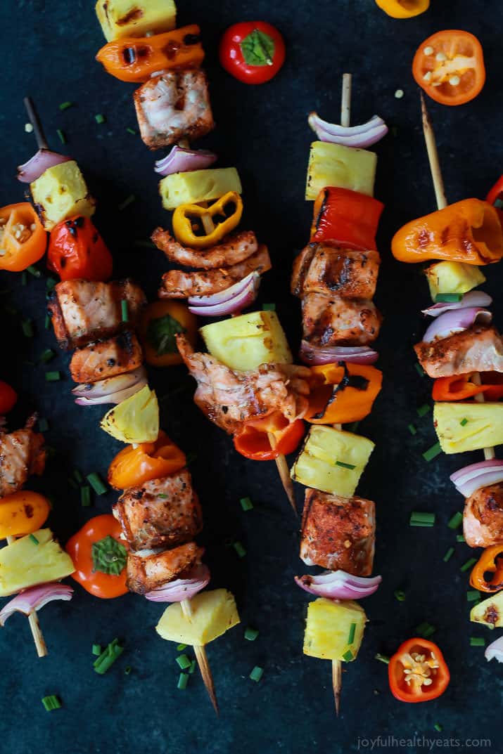 Caribbean Grilled Salmon Kabobs with cajun spices, fresh pineapple, bell peppers, and fresh seafood