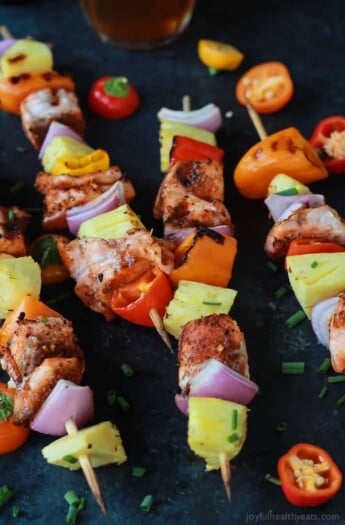 Caribbean Grilled Salmon Kabobs will take you straight to the islands with the cajun spices, fresh pineapple, bell peppers, and fresh seafood! Perfect healthy grilling recipe for the summer done in 20 minutes! | joyfulhealthyeats.com #recipes Easy Healthy Recipes
