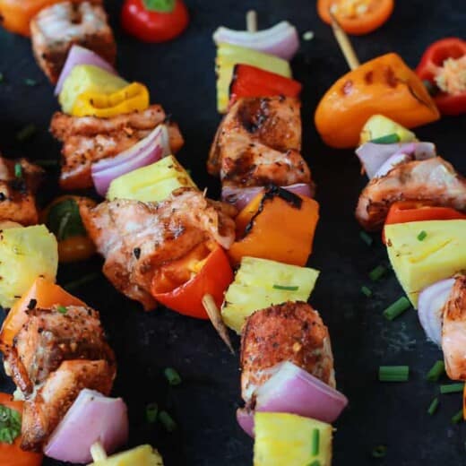 Caribbean Grilled Salmon Kabobs will take you straight to the islands with the cajun spices, fresh pineapple, bell peppers, and fresh seafood! Perfect healthy grilling recipe for the summer done in 20 minutes! | joyfulhealthyeats.com #recipes Easy Healthy Recipes