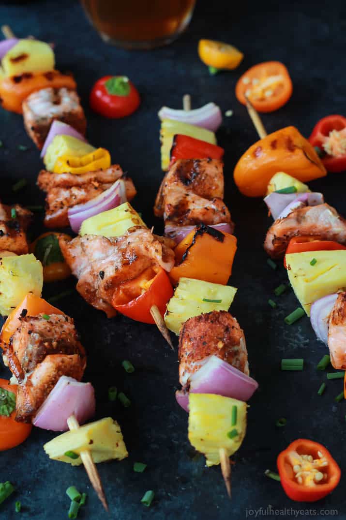 Caribbean Grilled Salmon Kabobs will take you straight to the islands with the cajun ،es, fresh pineapple, bell peppers, and fresh seafood! Perfect healthy grilling recipe for the summer done in 20 minutes! | joyfulhealthyeats.com #recipes Easy Healthy Recipes