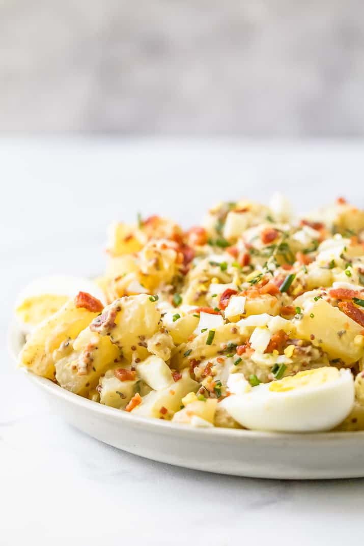 side view of creamy easy potato salad recipe with bacon