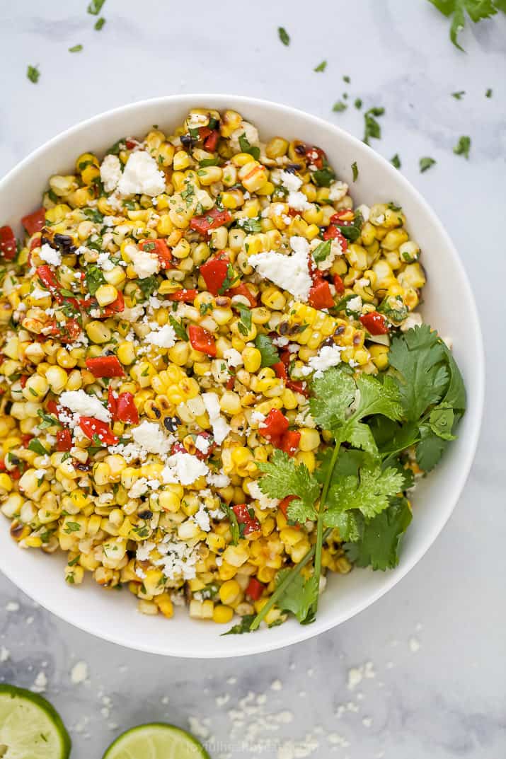 corn salad in a bowl with cilantro on top