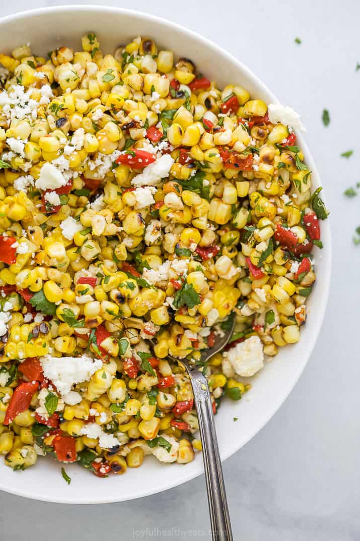 close up of grilled corn salad in a bowl