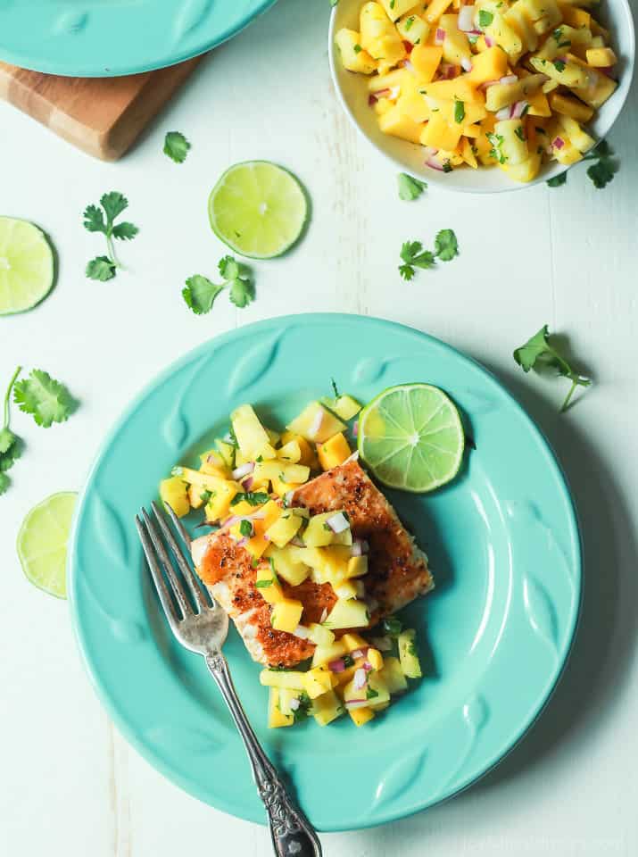 Top view of Pan Seared Cajun Mahi Mahi with a fresh Mango Pineapple Salsa on a plate