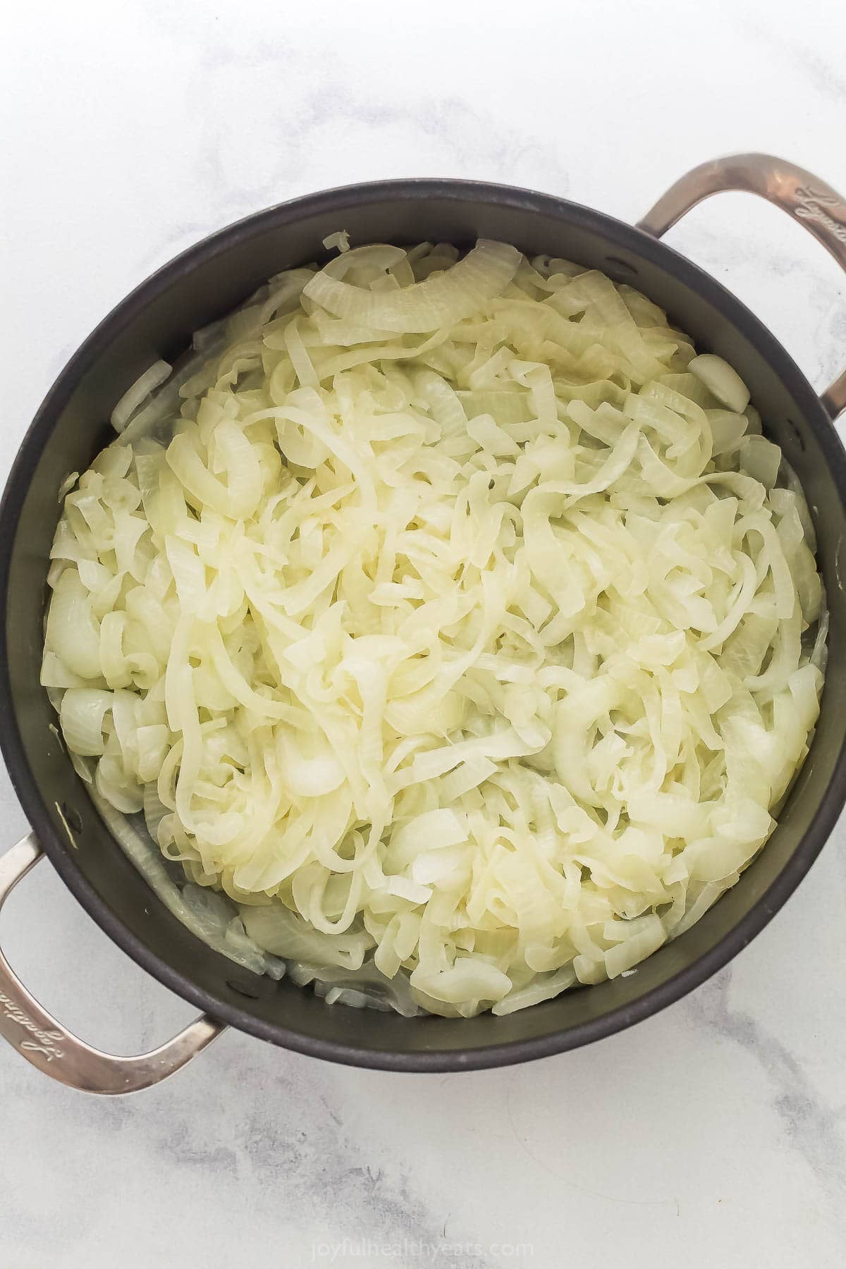 Onions sweating in skillet.