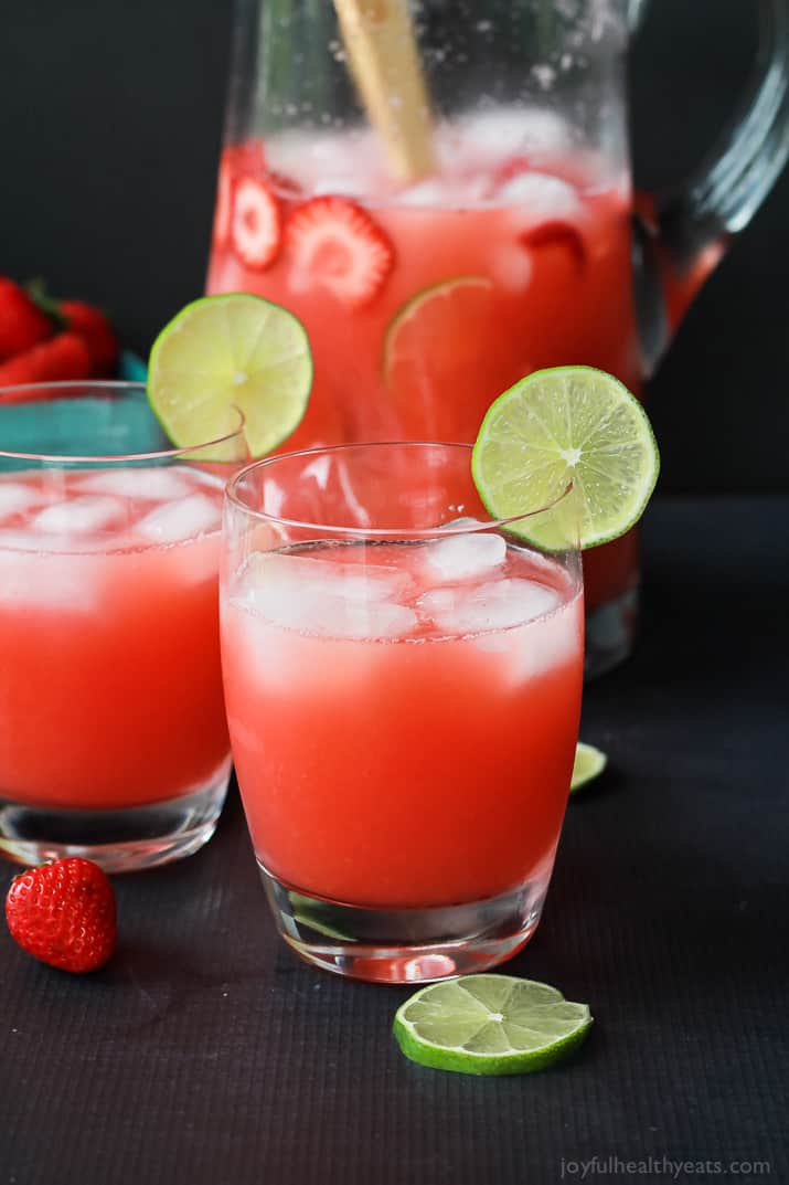 A pitcher and two glasses of Fresh Strawberry Limeade