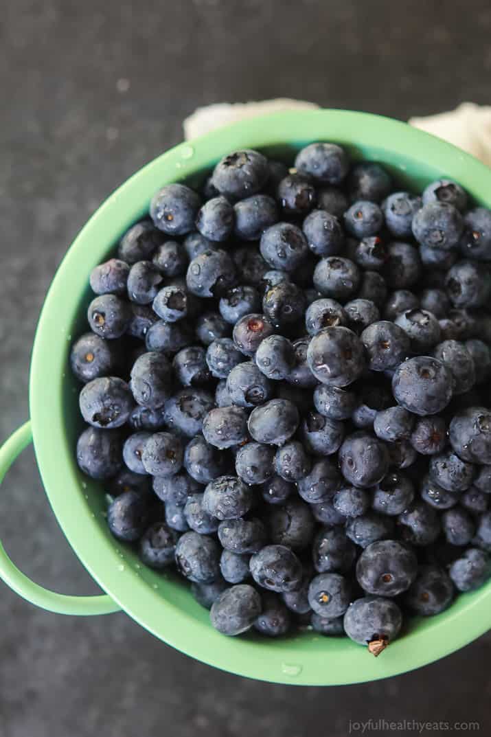 Top view of fresh blueberries in a colander