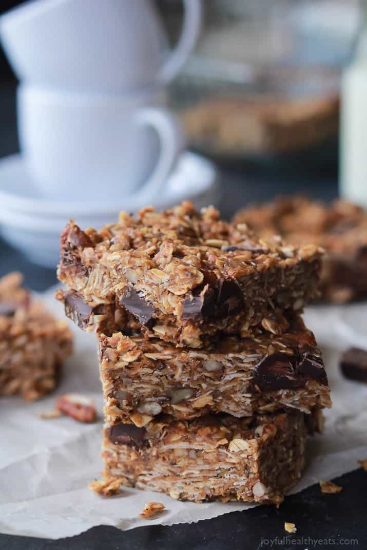 Breakfast never tasted so good with these No Bake Peanut Butter Chocolate Bars, done in 5 minutes! Filled with chocolate chunks, creamy peanut butter, chia seeds, and loads of other nutrients to fill you up! | joyfulhealthyeats.com #recipes